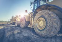 Construction vehicles at building site.