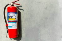 Fire extinguisher on concrete wall