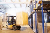 Gas powered forklift operating in a facility