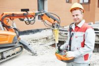 Worker using a demolition robot