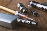 vaping devices or electronic cigarette on a wooden background
