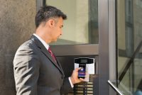 Man using smartphone for access controls